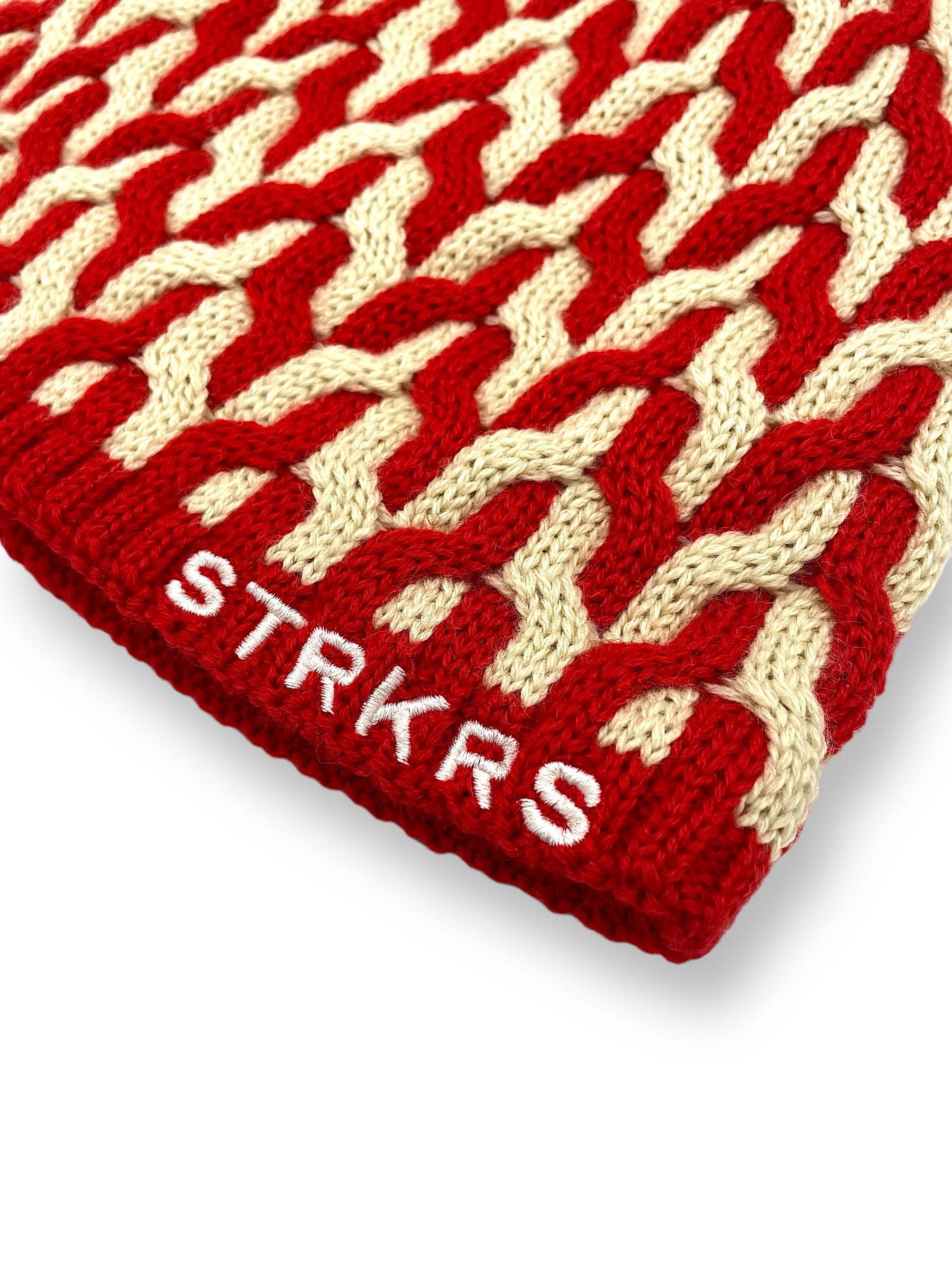 STRKRS red and white mens women's unisex soft warm insulating wool acrylic blend uniquely patterned low profile skullcap beanie with brim. Line with a cozy polyester fleece interior. STRKRS Logo embroidered on ribbed brim.