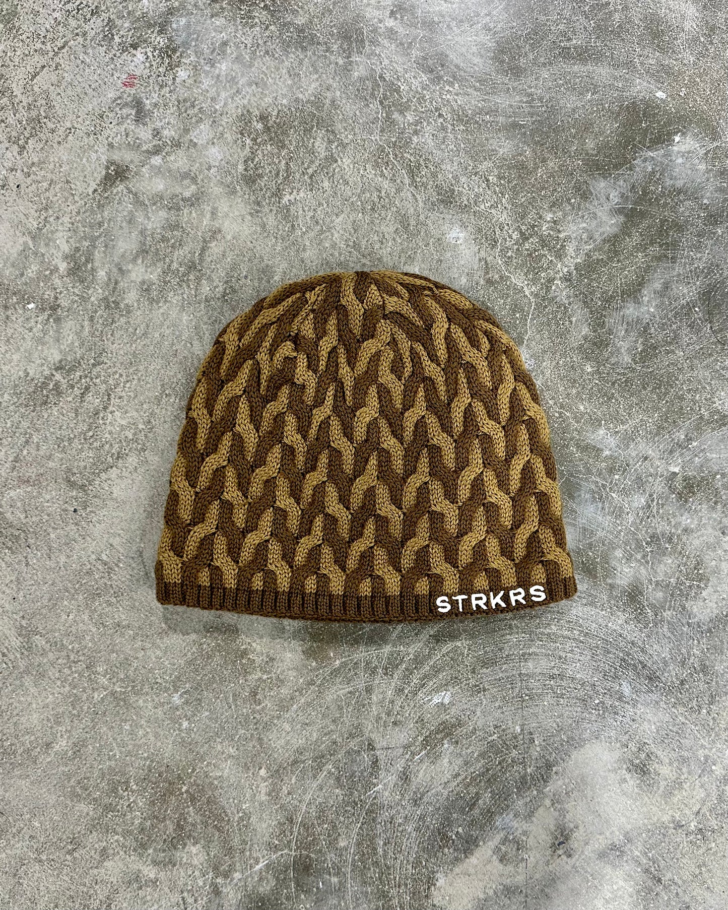 STRKRS dark brown and light brown mens women's unisex soft warm insulating wool acrylic blend uniquely patterned low profile skullcap beanie with brim. Line with a cozy polyester fleece interior. STRKRS Logo embroidered on ribbed brim.