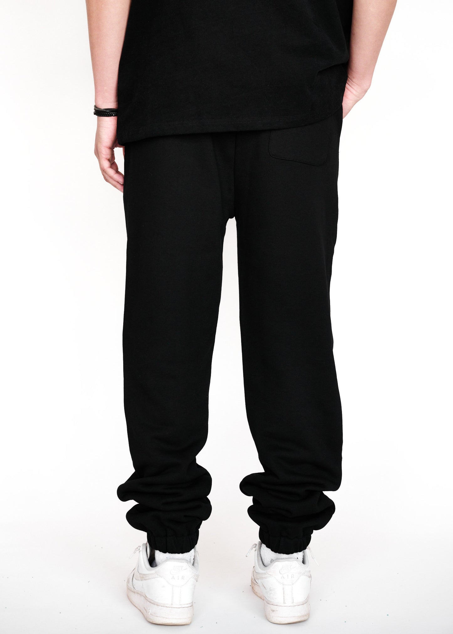 STRKRS black and white mens women's unisex 100% French Terry cotton heavyweight relaxed slightly baggy sweatpants. STRKRS Core Logo screen printed at center chest.