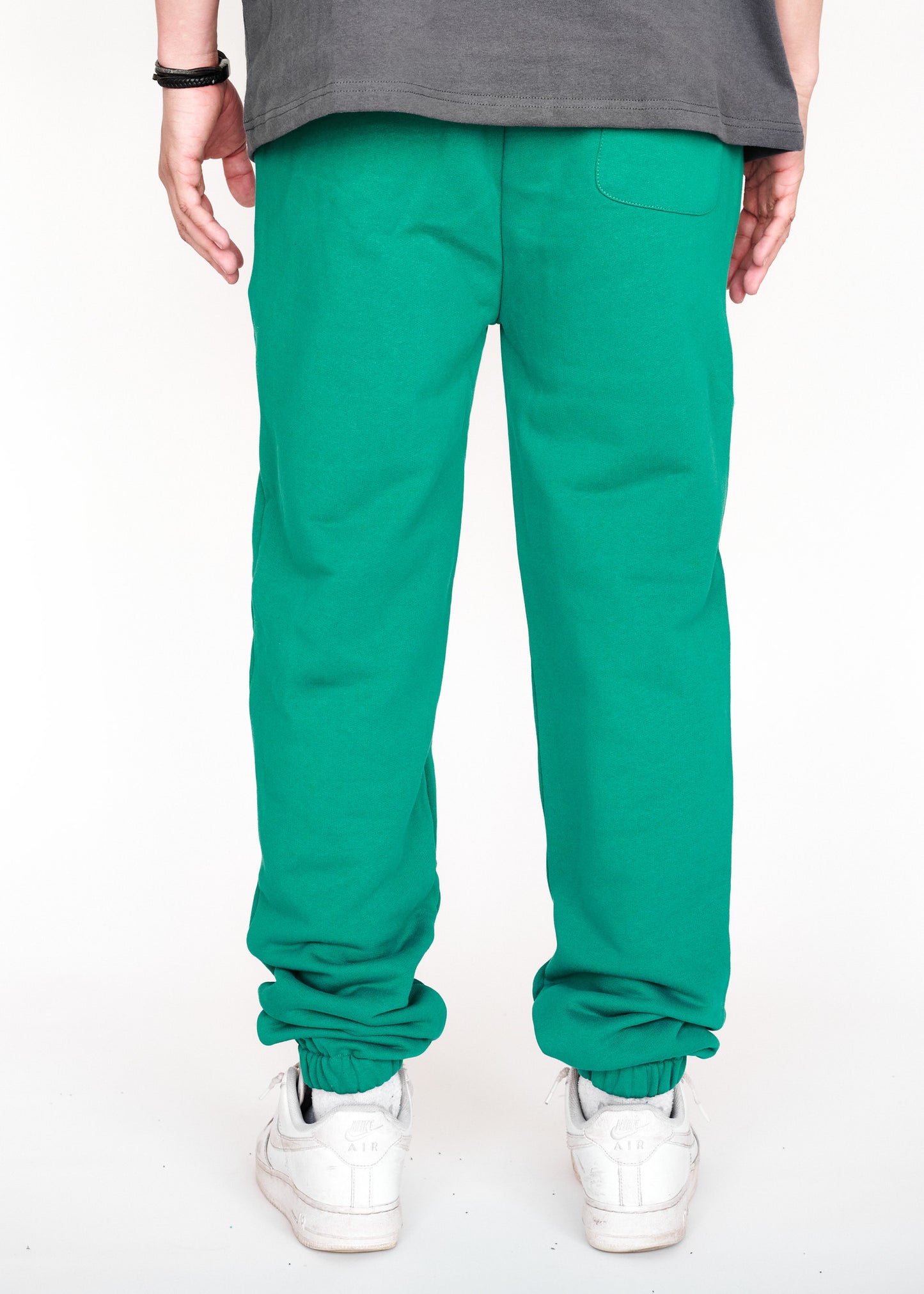 STRKRS cadmium green mens women's unisex 100% French Terry cotton heavyweight relaxed slightly baggy sweatpants. STRKRS Core Logo screen printed at center chest.