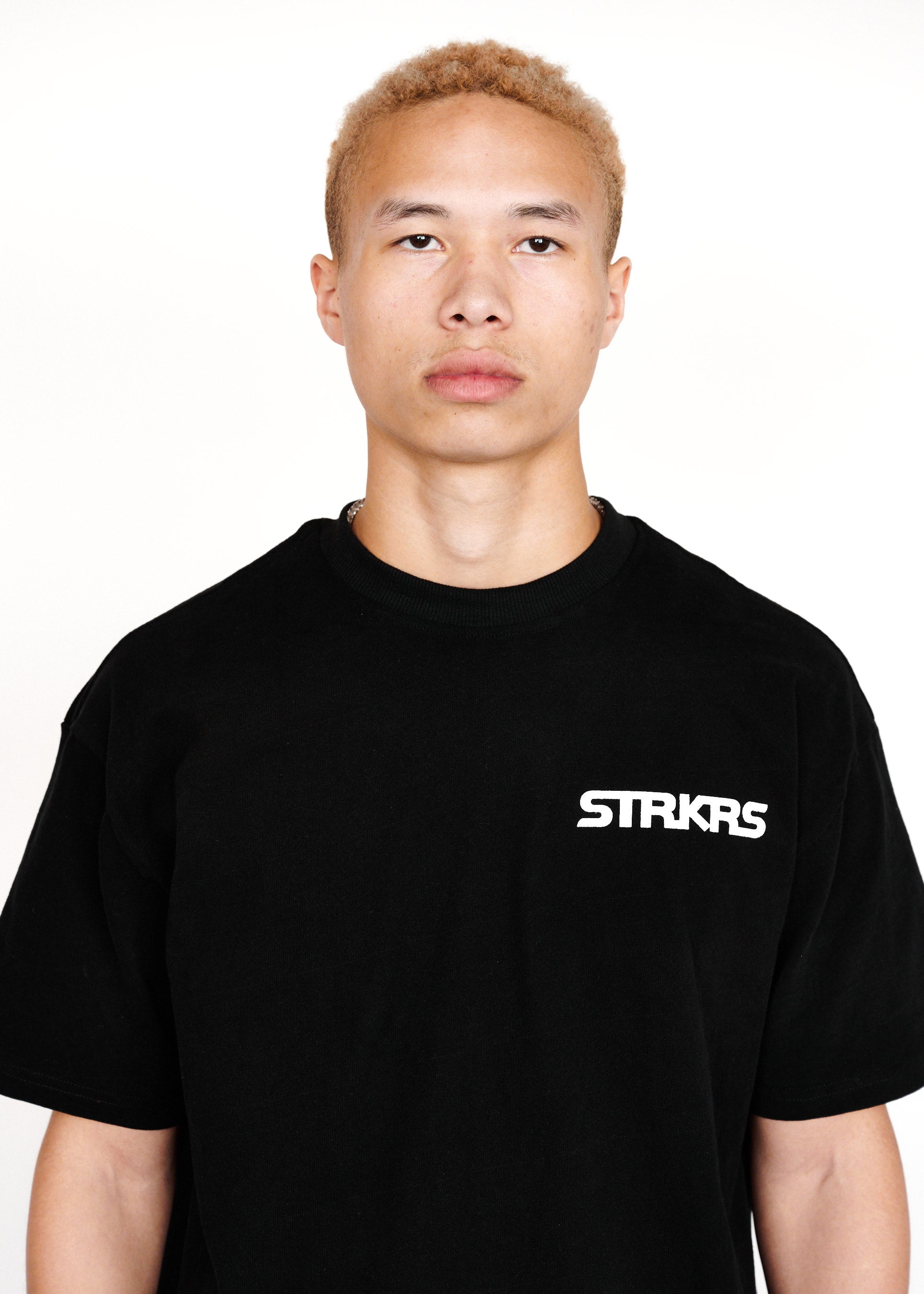 STRKRS black and white mens women's unisex 100% cotton heavyweight crewneck relaxed slightly oversized t-shirt. Single-minded Driven Purposeful on back of t-shirt
