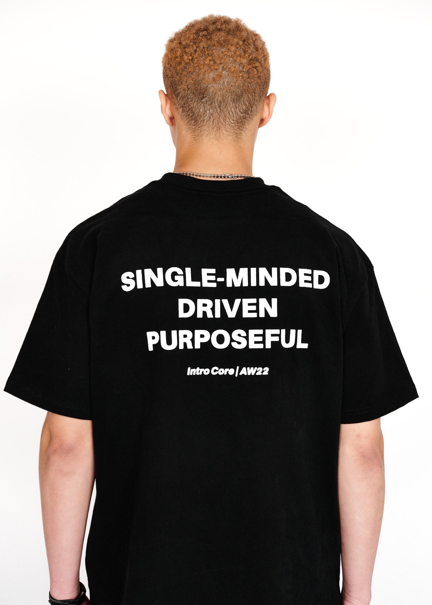 STRKRS black and white mens women's unisex 100% cotton heavyweight crewneck relaxed slightly oversized t-shirt. Single-minded Driven Purposeful on back of t-shirt