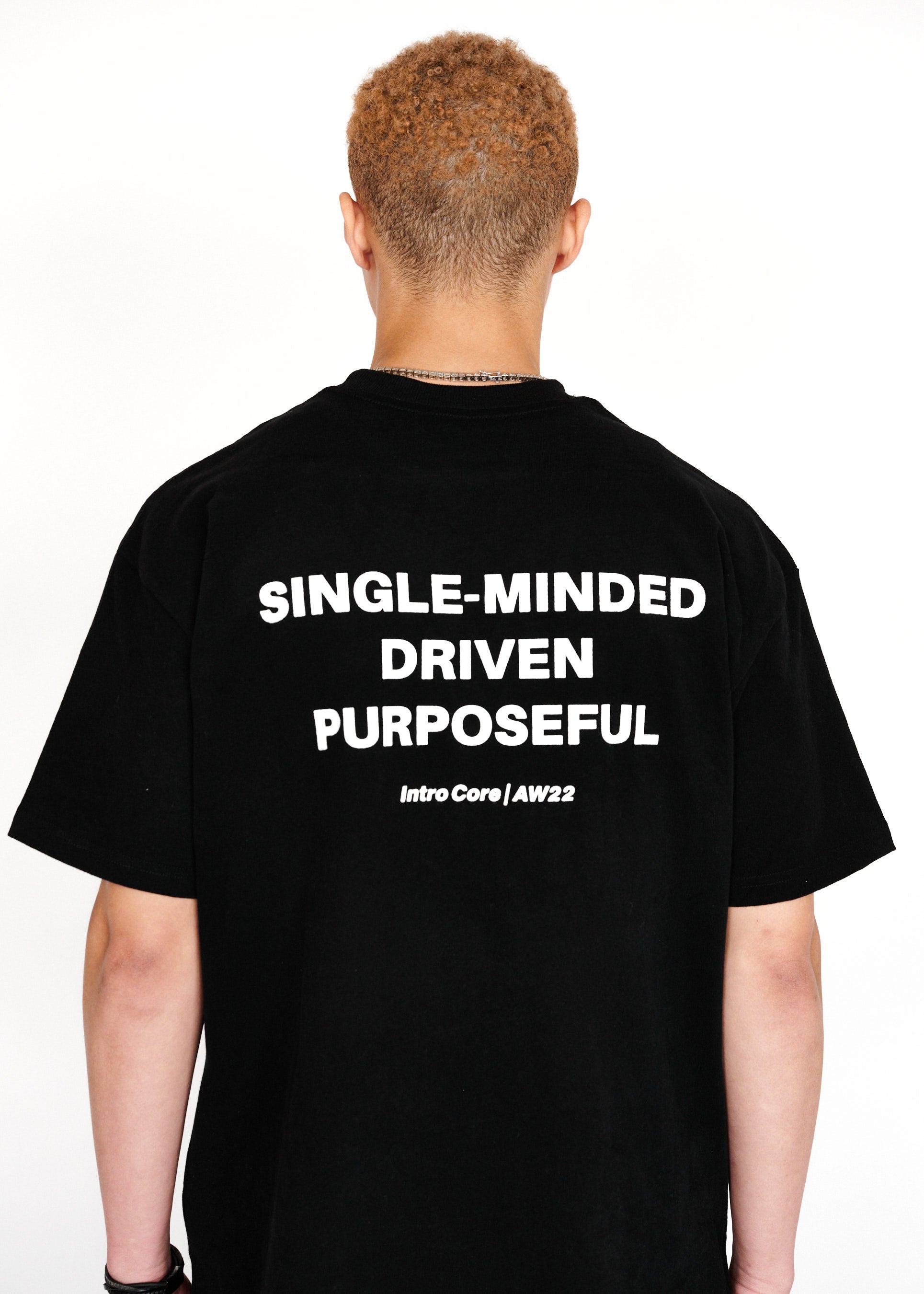 STRKRS black and white mens women's unisex 100% cotton heavyweight crewneck relaxed slightly oversized t-shirt. Single-minded Driven Purposeful on back of t-shirt