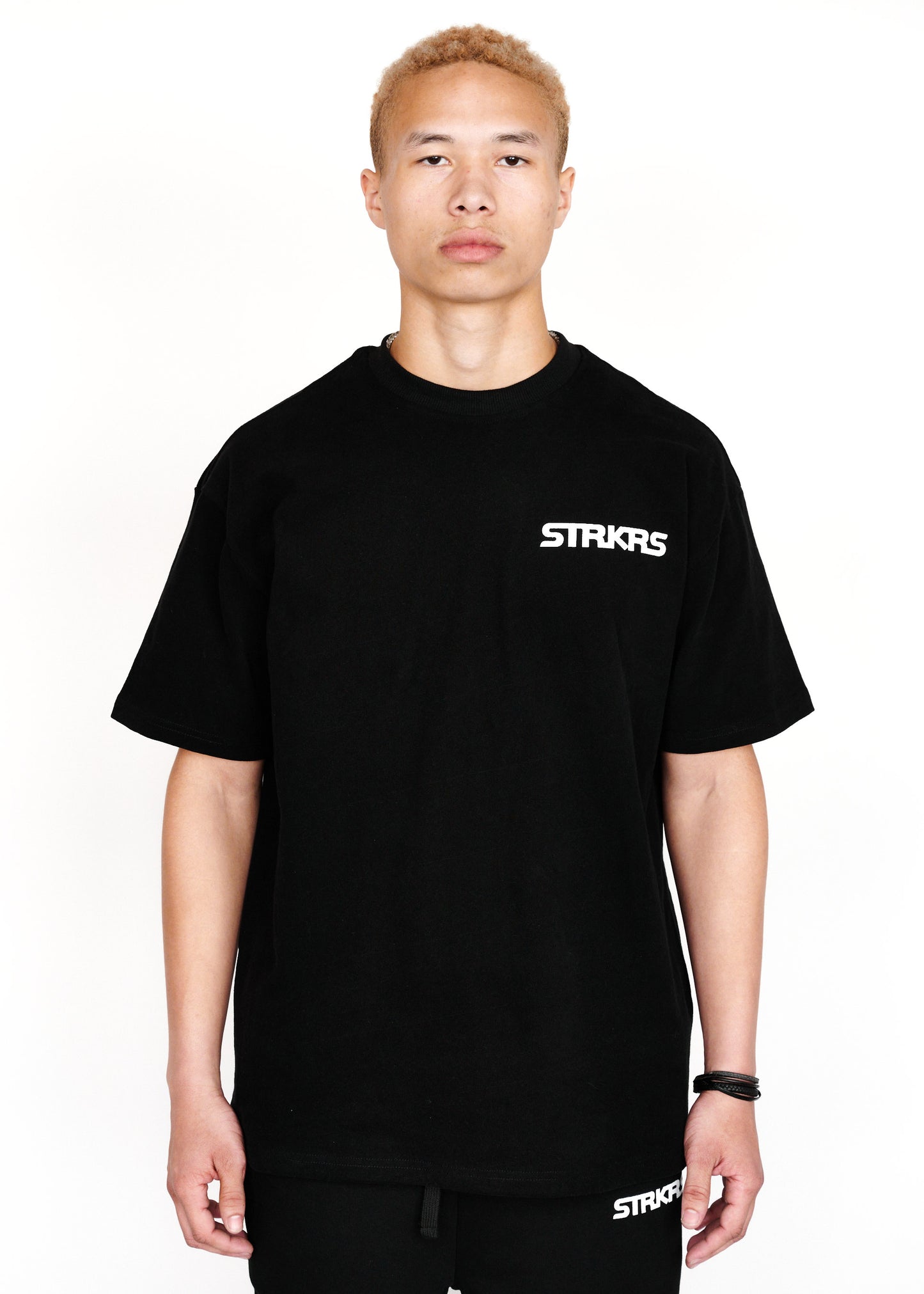 STRKRS black and white mens women's unisex 100% cotton heavyweight crewneck relaxed slightly oversized t-shirt. Single-minded Driven Purposeful on back of t-shirt