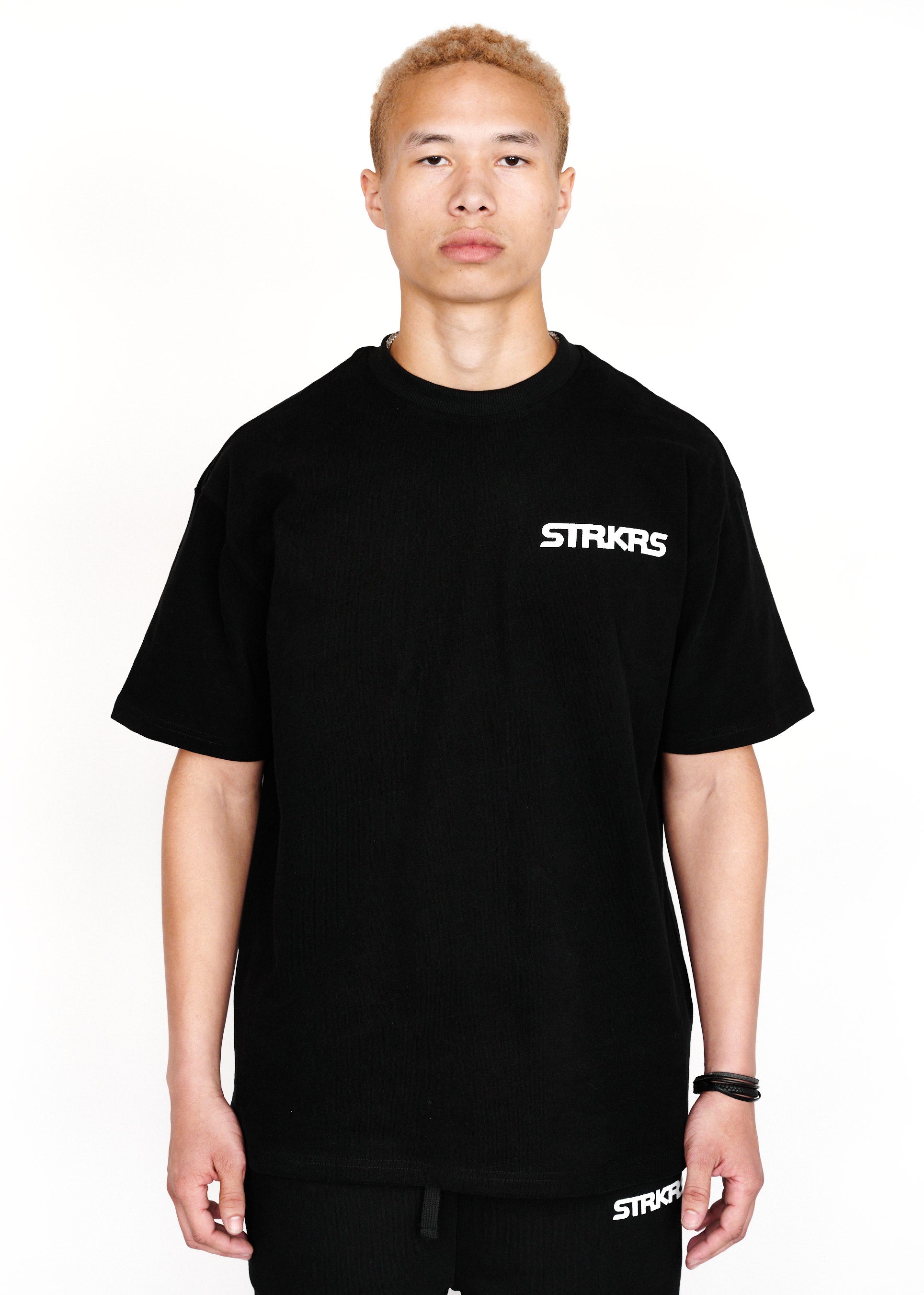 STRKRS black and white mens women's unisex 100% cotton heavyweight crewneck relaxed slightly oversized t-shirt. Single-minded Driven Purposeful on back of t-shirt