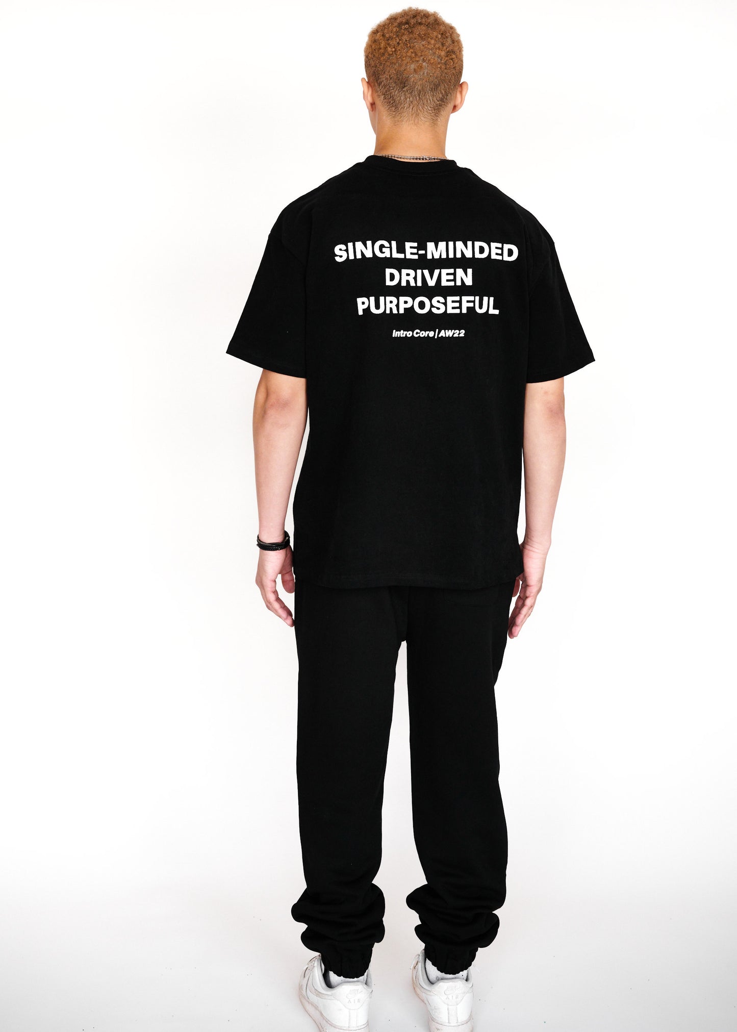 STRKRS black and white mens women's unisex 100% cotton heavyweight crewneck relaxed slightly oversized t-shirt. Single-minded Driven Purposeful on back of t-shirt