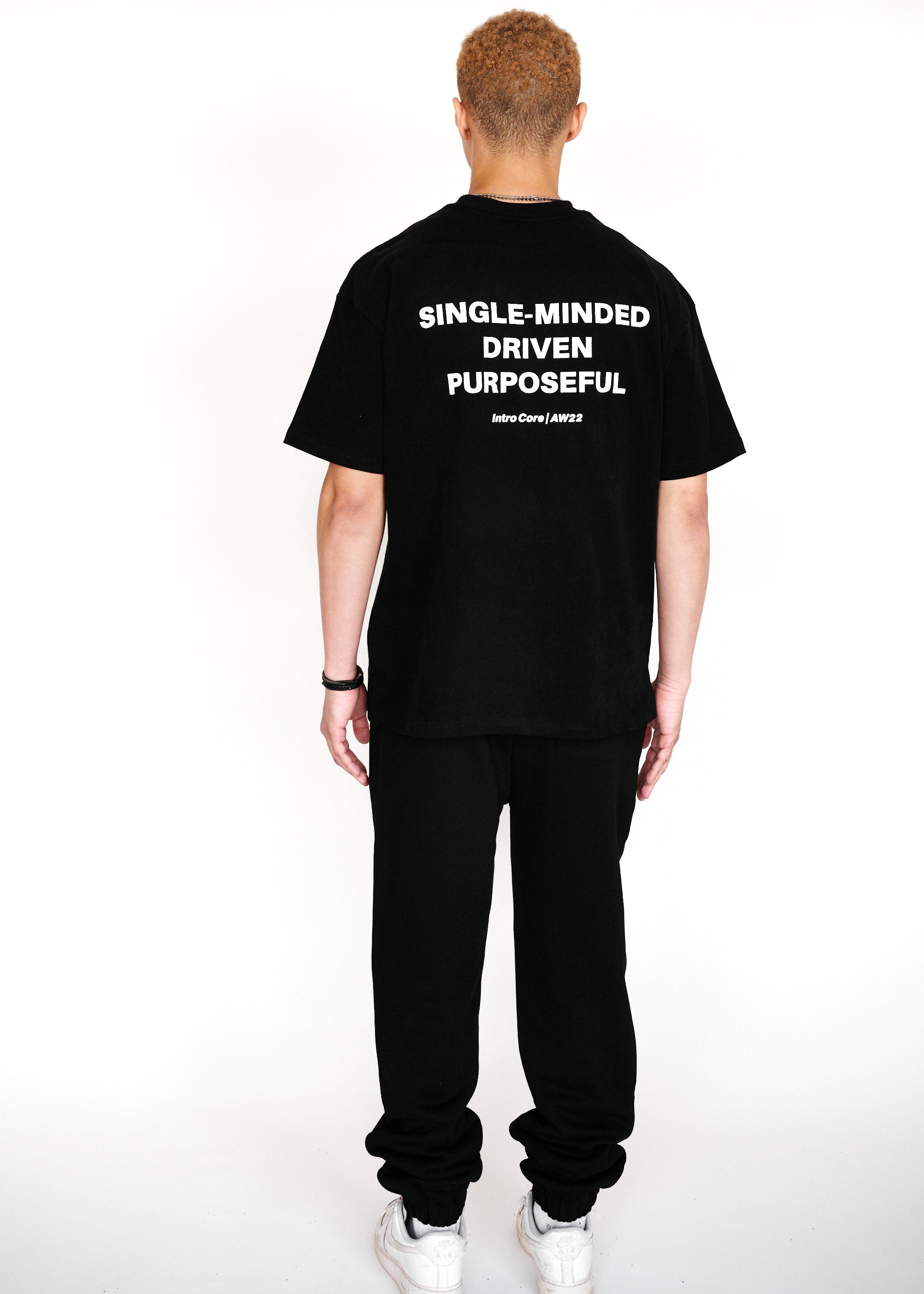 STRKRS black and white mens women's unisex 100% cotton heavyweight crewneck relaxed slightly oversized t-shirt. Single-minded Driven Purposeful on back of t-shirt
