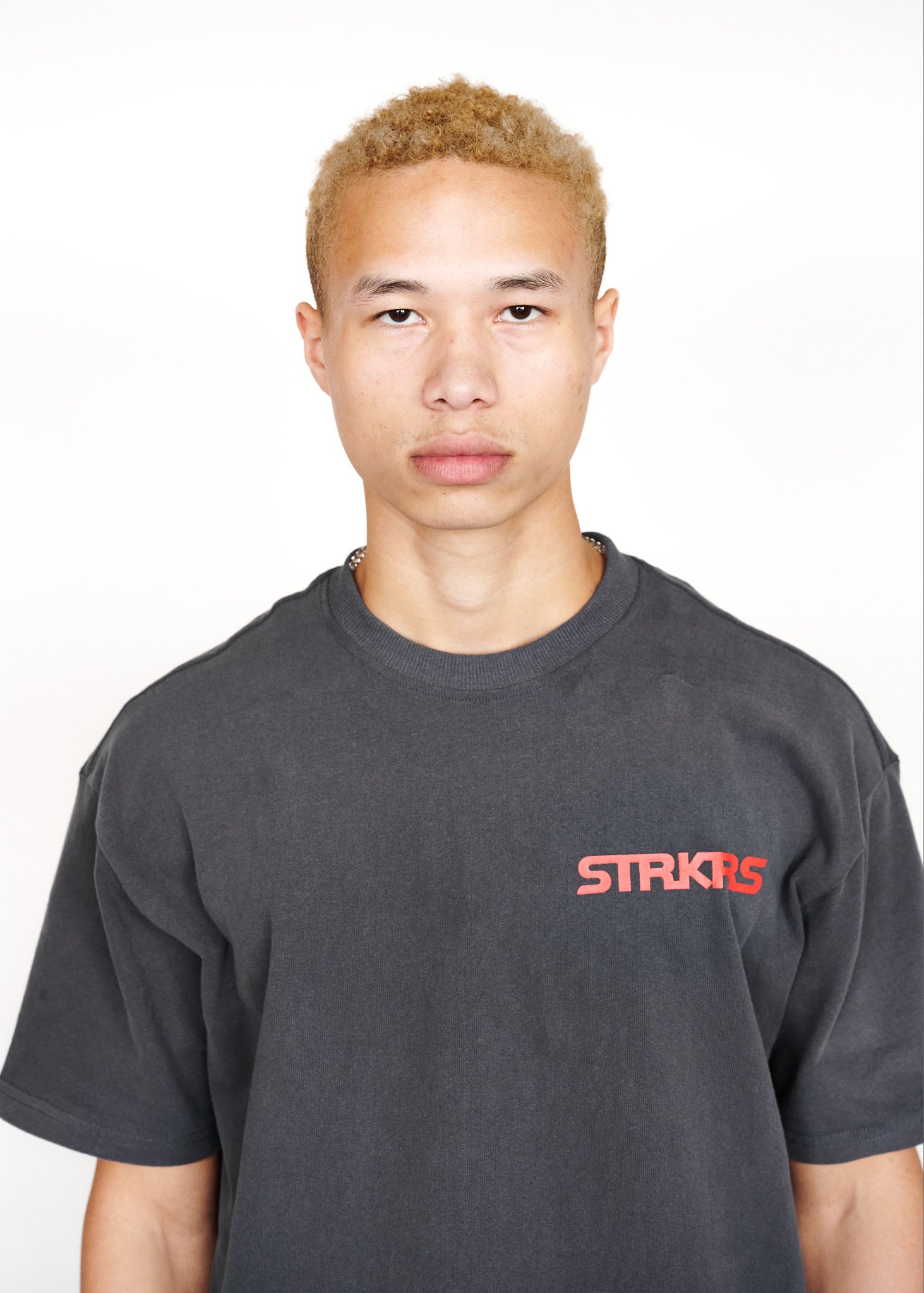 STRKRS washed gray and red mens women's unisex 100% cotton heavyweight crewneck relaxed slightly oversized t-shirt. Single-minded Driven Purposeful on back of t-shirt
