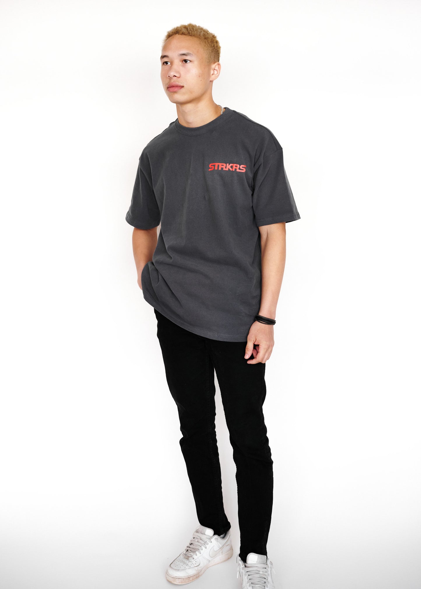 STRKRS washed gray and red mens women's unisex 100% cotton heavyweight crewneck relaxed slightly oversized t-shirt. Single-minded Driven Purposeful on back of t-shirt
