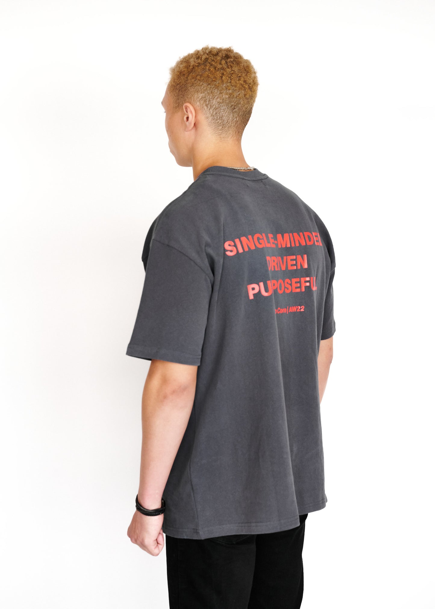STRKRS washed gray and red mens women's unisex 100% cotton heavyweight crewneck relaxed slightly oversized t-shirt. Single-minded Driven Purposeful on back of t-shirt