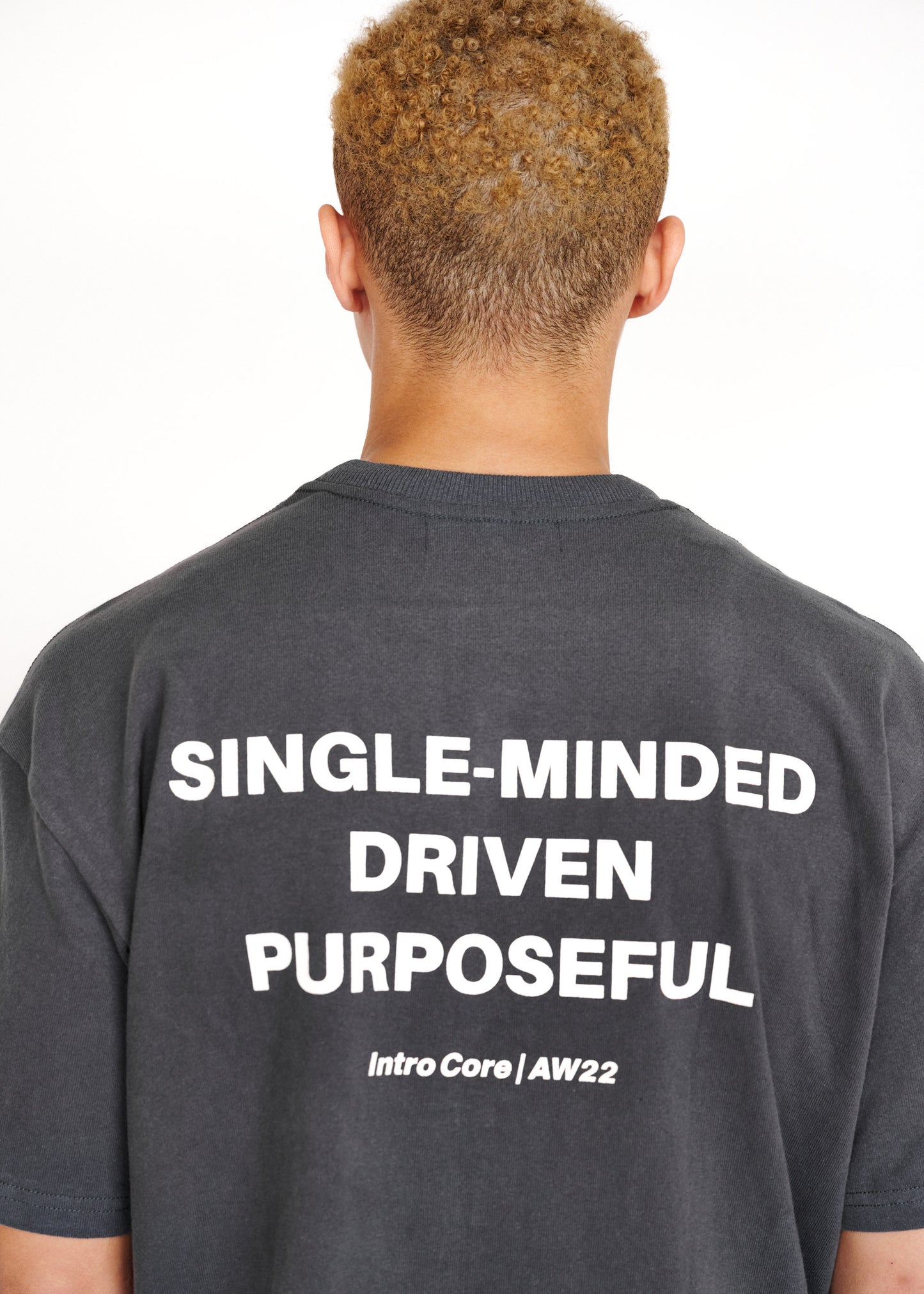 STRKRS washed gray and white mens women's unisex 100% cotton heavyweight crewneck relaxed slightly oversized t-shirt. Single-minded Driven Purposeful on back of t-shirt