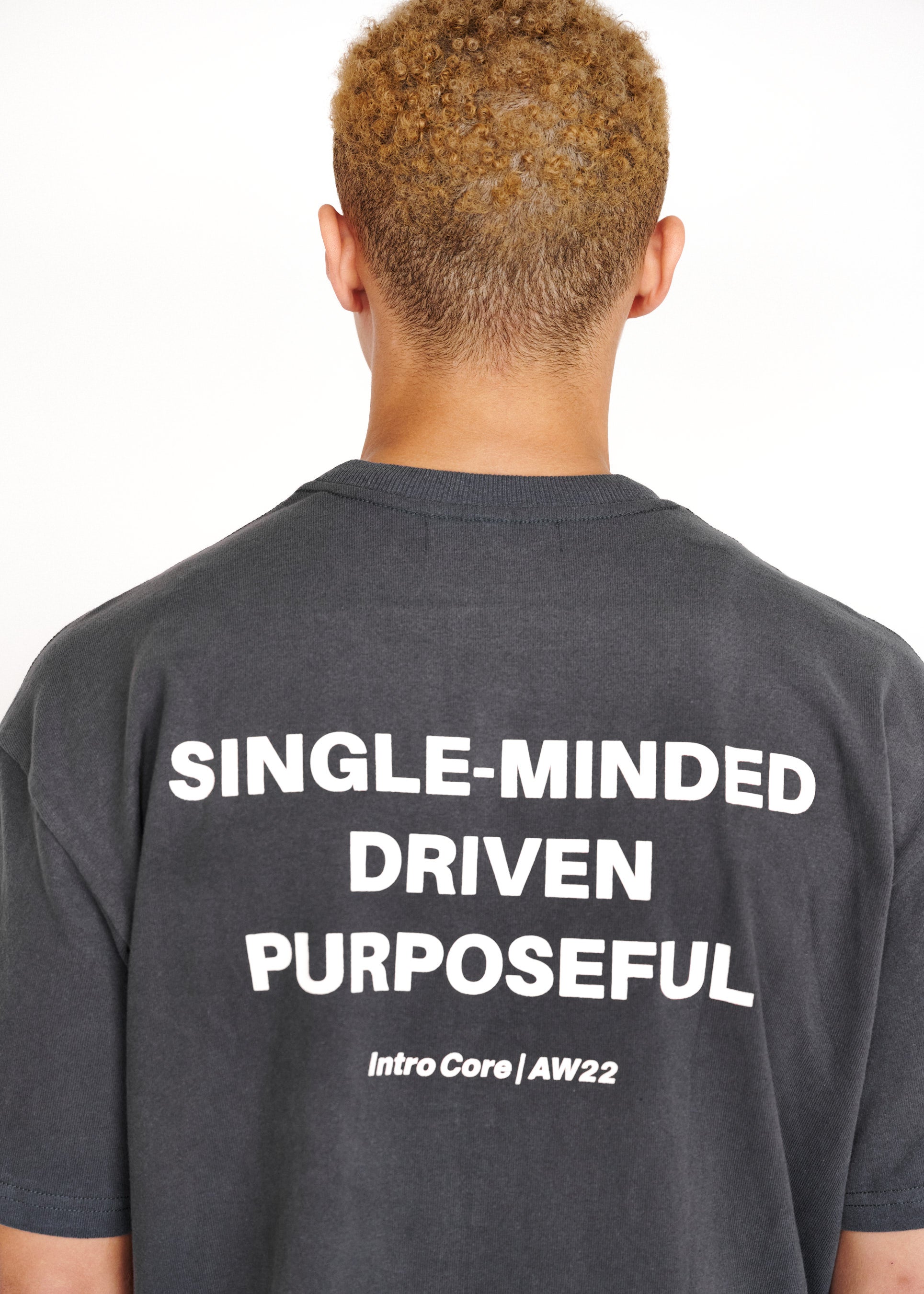 STRKRS washed gray and white mens women's unisex 100% cotton heavyweight crewneck relaxed slightly oversized t-shirt. Single-minded Driven Purposeful on back of t-shirt