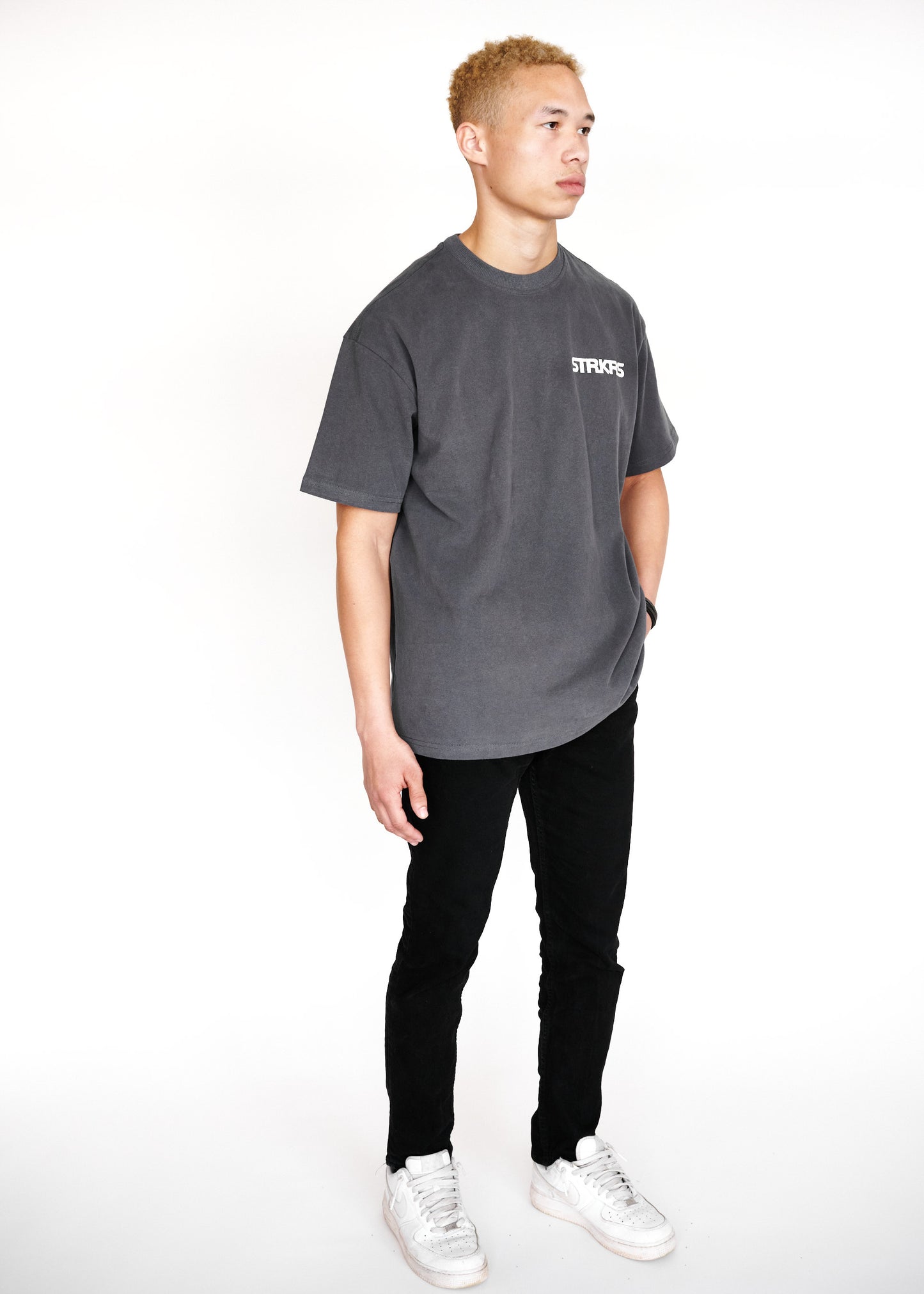 STRKRS washed gray and white mens women's unisex 100% cotton heavyweight crewneck relaxed slightly oversized t-shirt. Single-minded Driven Purposeful on back of t-shirt