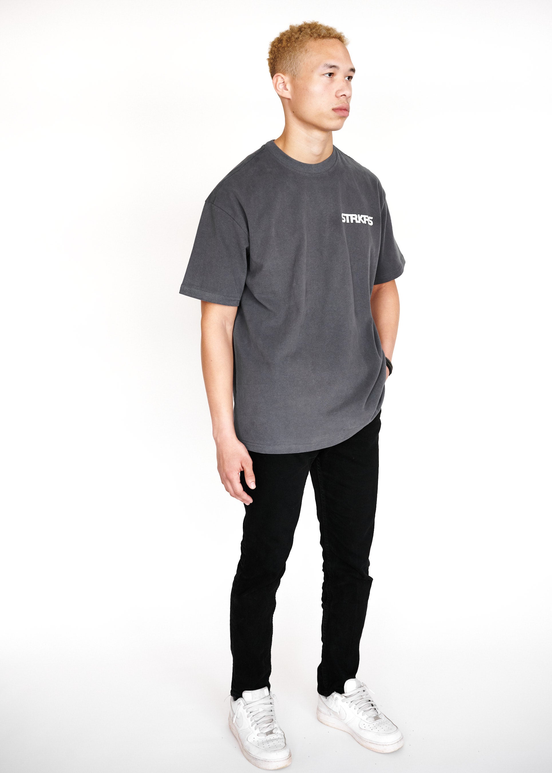 STRKRS washed gray and white mens women's unisex 100% cotton heavyweight crewneck relaxed slightly oversized t-shirt. Single-minded Driven Purposeful on back of t-shirt